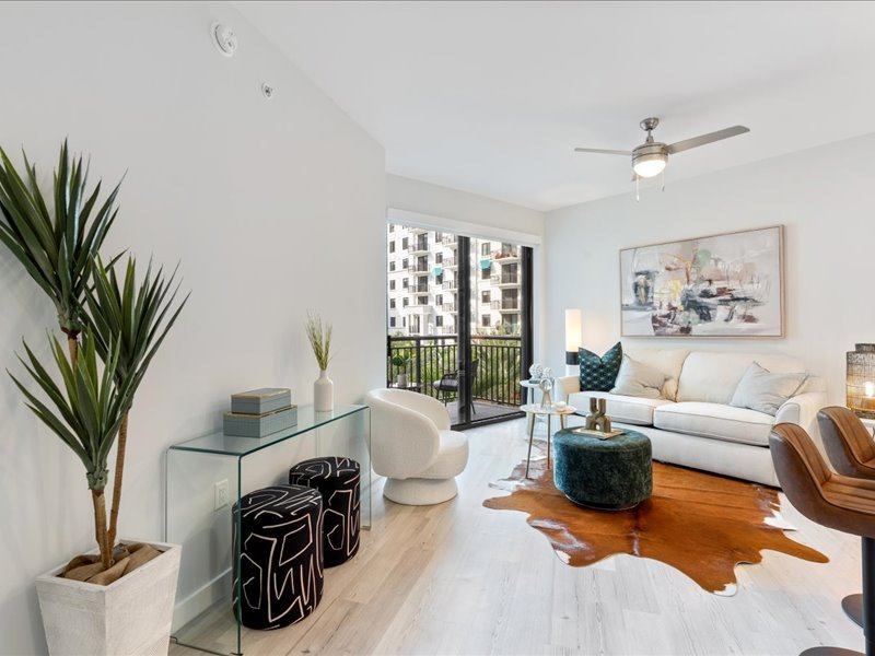 a living room with a couch and a chair and a table