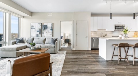 A modern living room with a brown chair in the foreground.