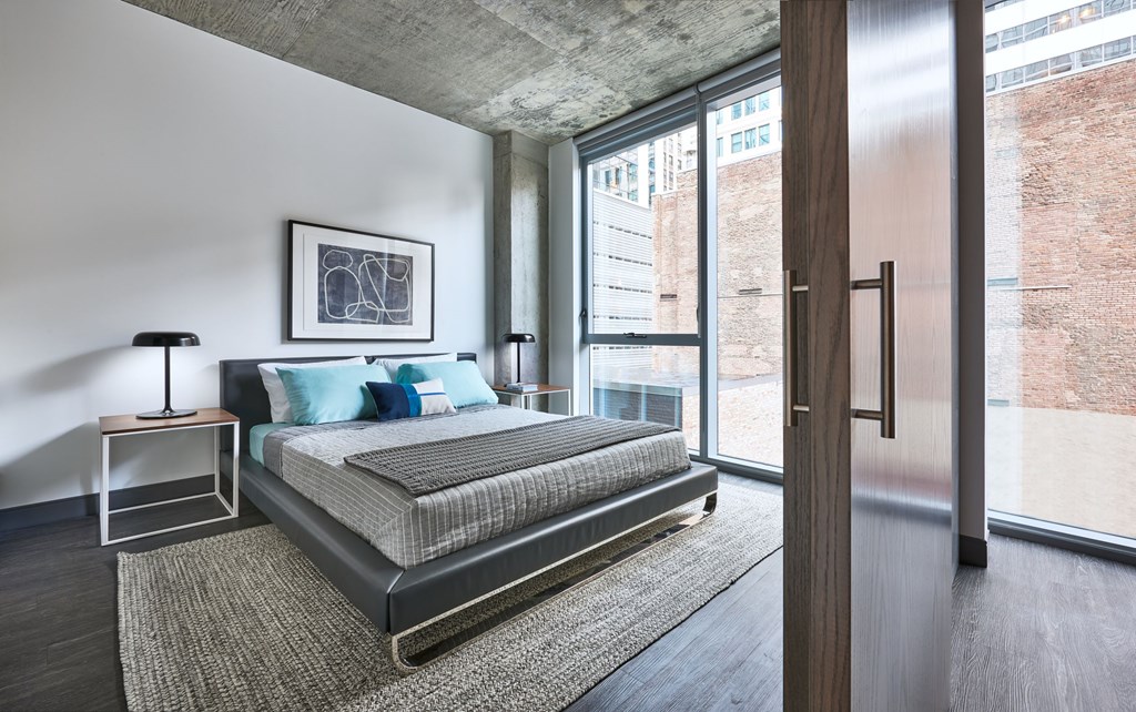 Furnished model view from living room to bedroom 