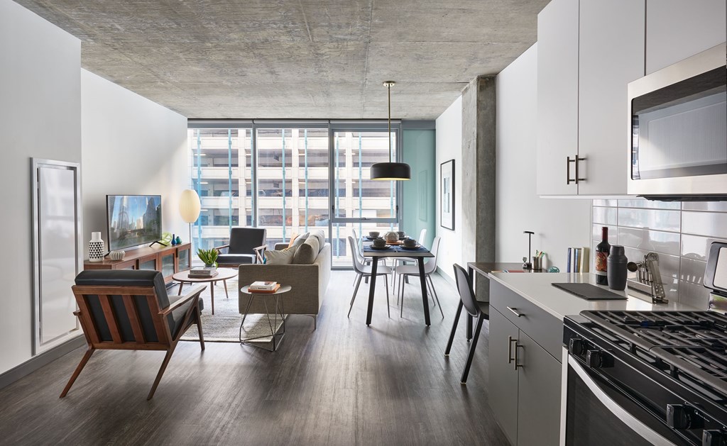 Furnished model view from kitchen to living room