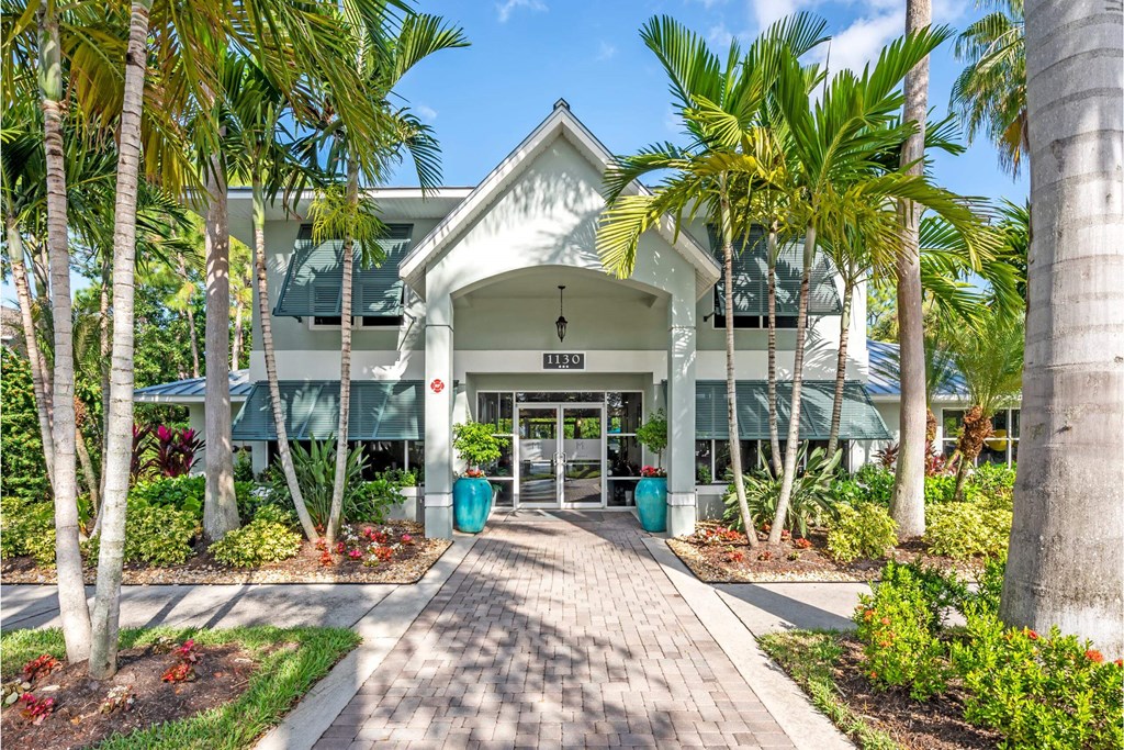 a building with palm trees in front of it