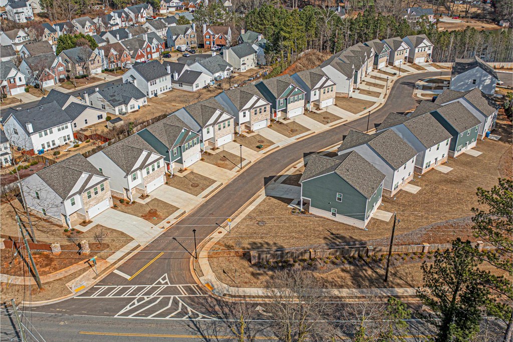 an aerial view of a row of houses on a street