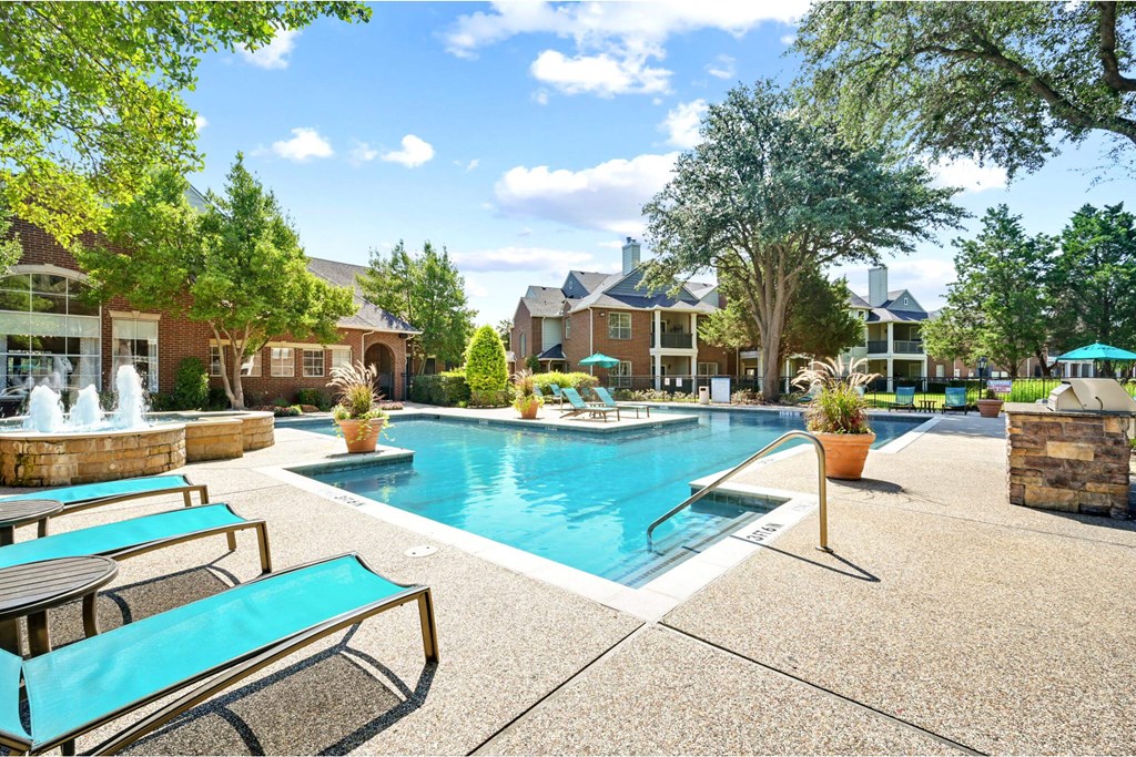 the preserve at ballantyne commons pool and resort style amenities with trees and buildings