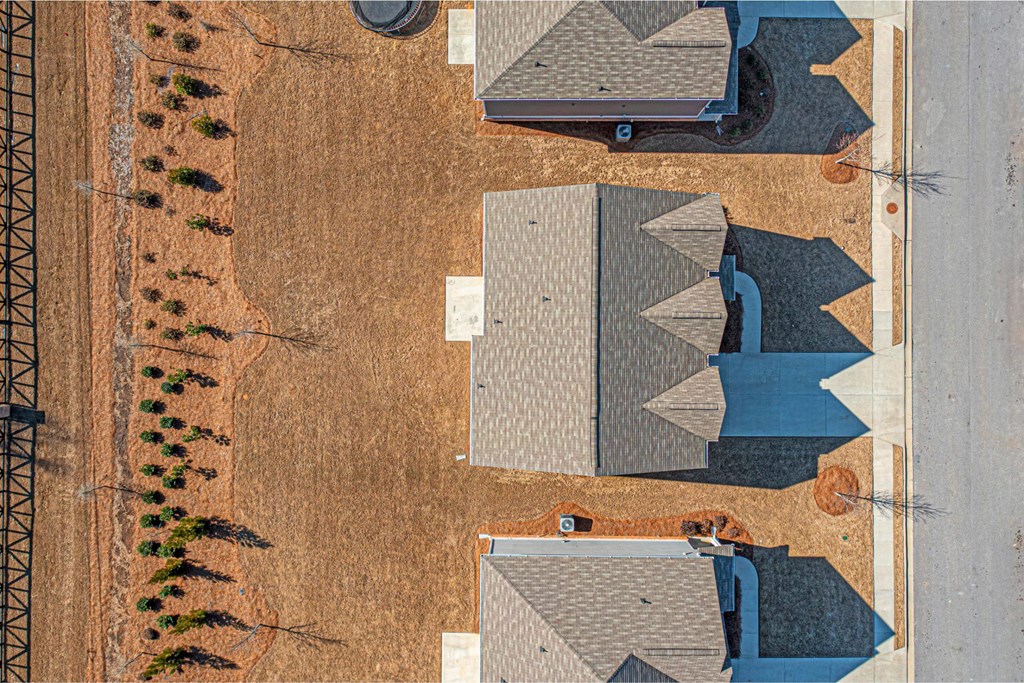 a birds eye view of a roof on a house in a field