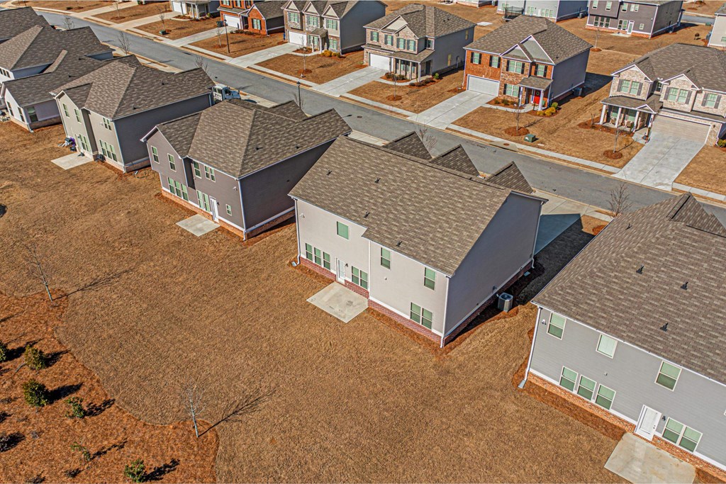 an aerial view of a row of houses in a neighborhood