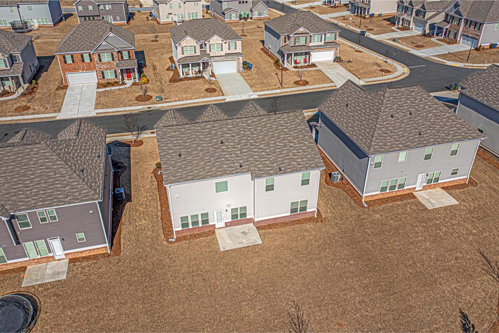 a group of houses in a neighborhood with new roofs
