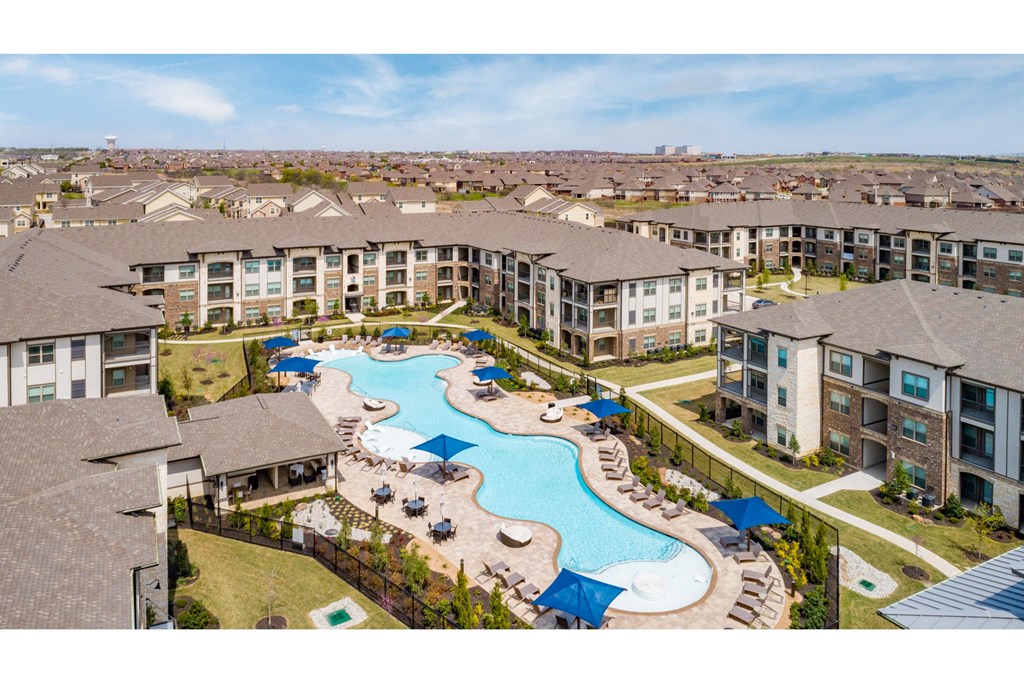 a rendering of a large apartment building with a swimming pool