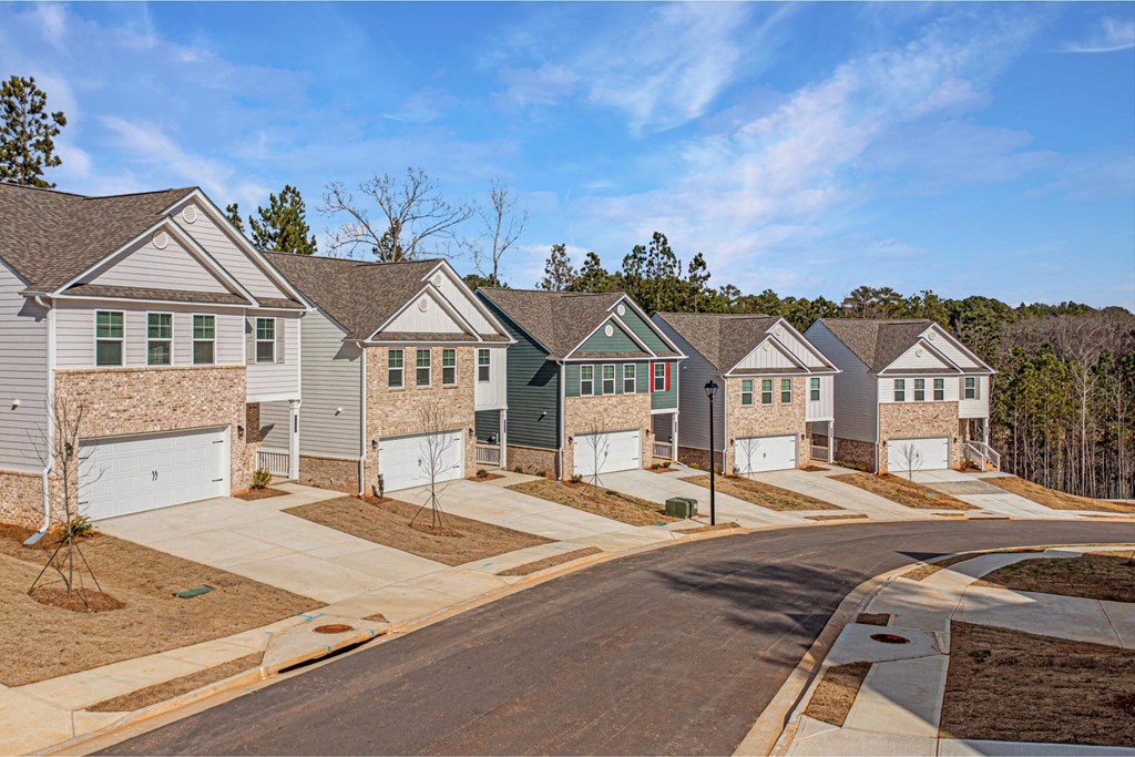 a row of houses on the side of a street