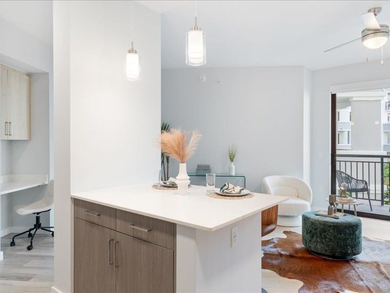 a kitchen and living room in an apartment