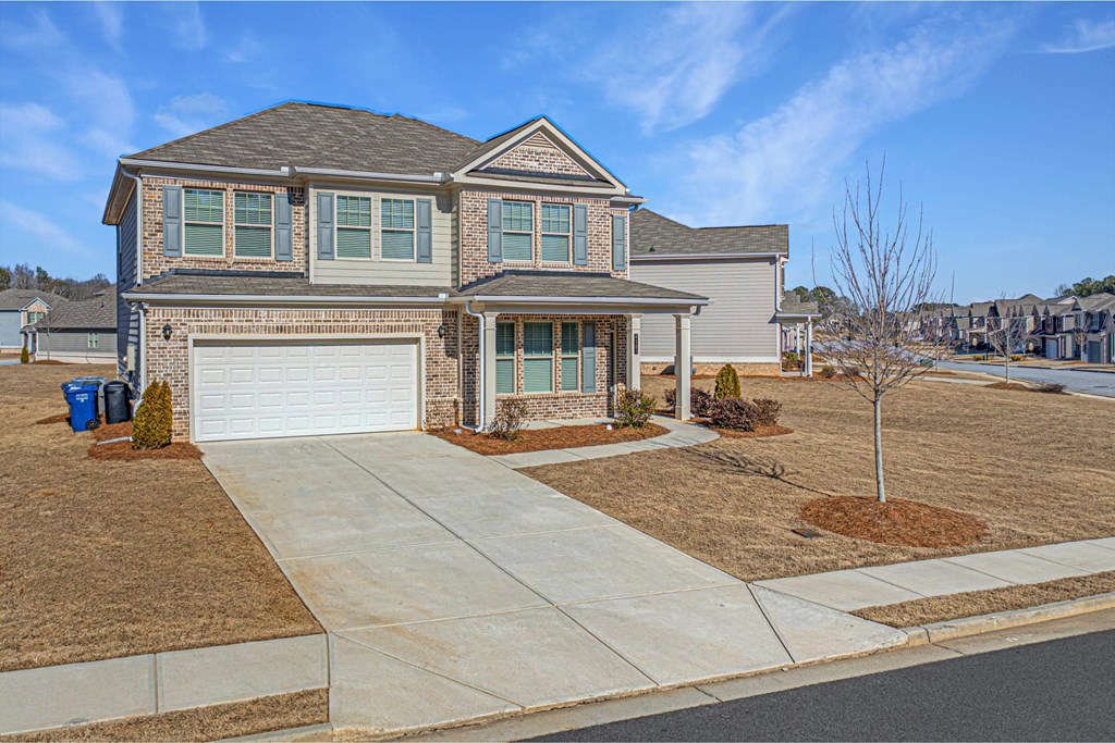 a house with a driveway and a garage door