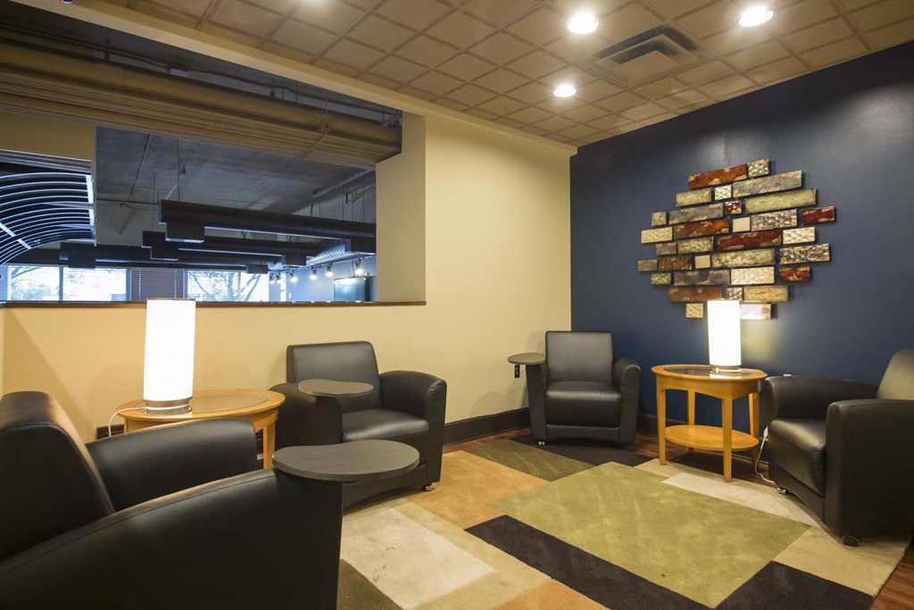 a lounge area with chairs and a coffee table
