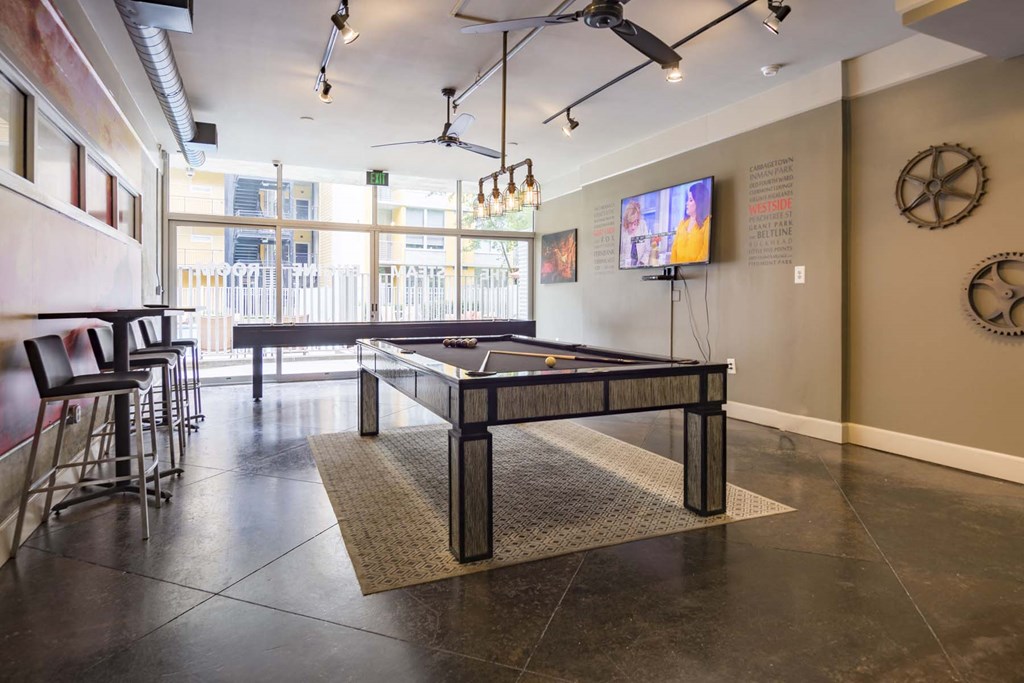 accommodation type with a pool table and a flat screen tv