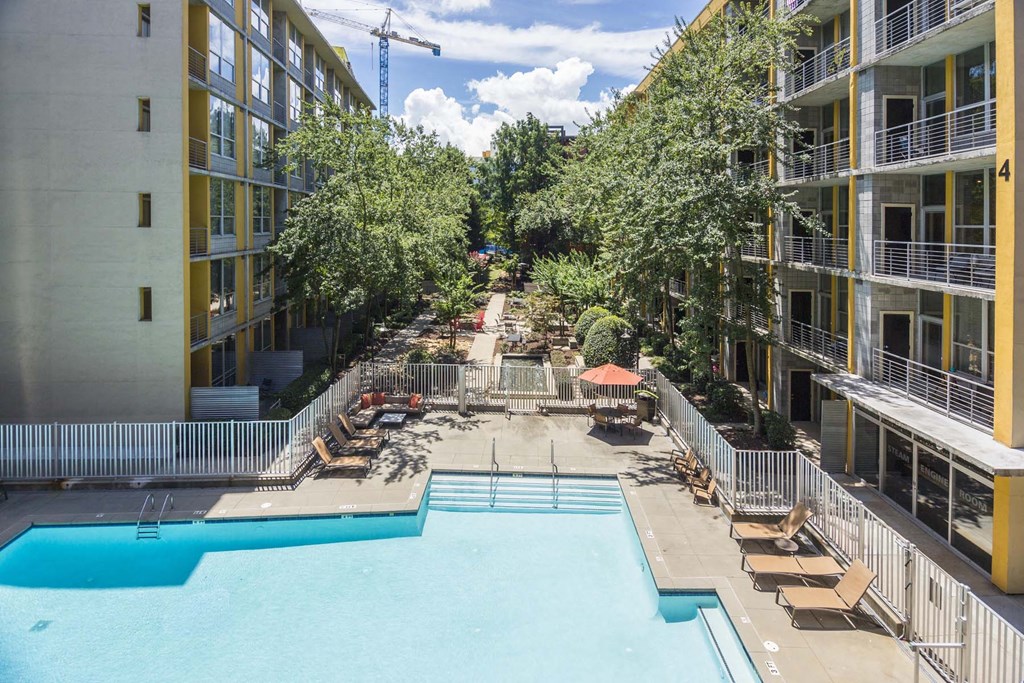 an aerial view of an apartment complex with a large pool