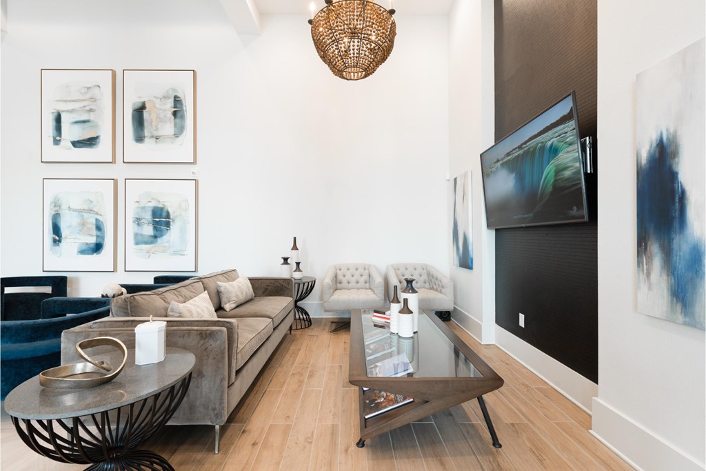a living room with a couch and a table and a television