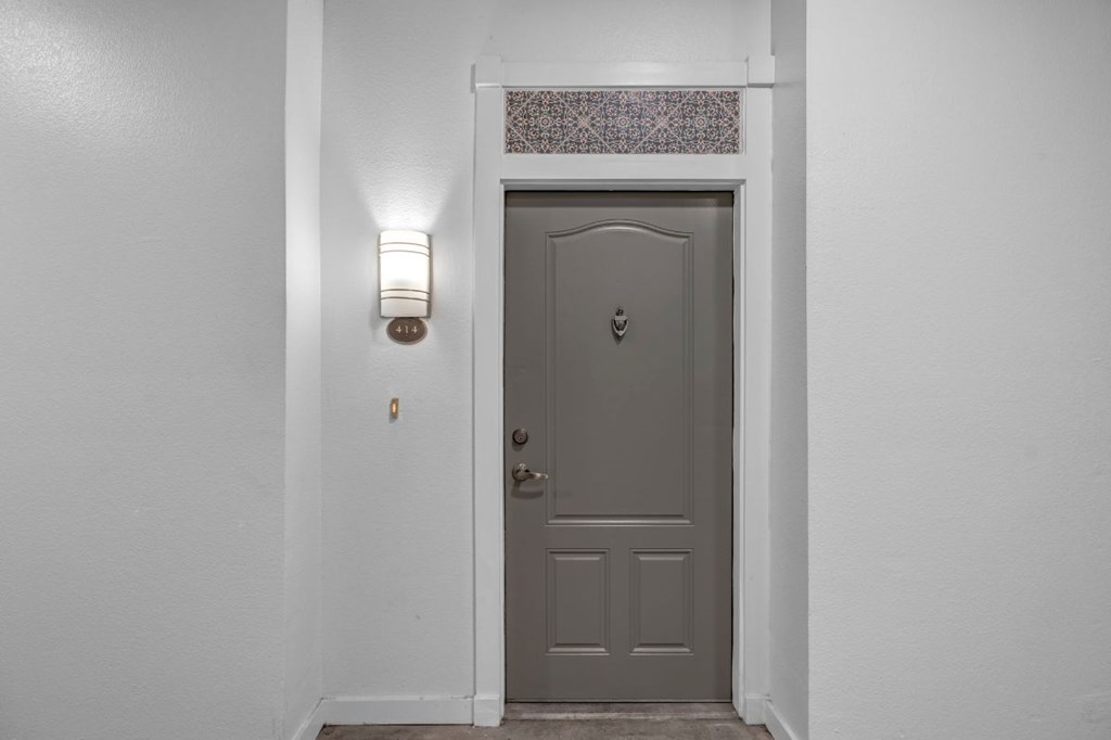 the front door of a home with a gray door
