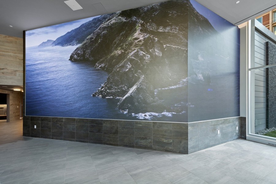 a large mural on a wall in a lobby of a building