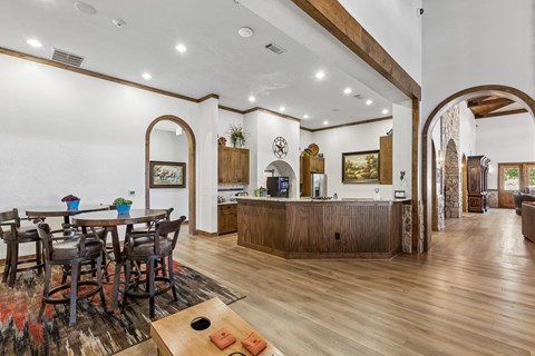 A dining room with a wooden table and chairs.