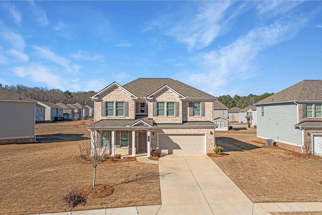 a neighborhood of manufactured homes on a dirt lot