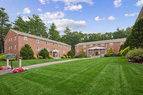 A large grassy area in front of a building.