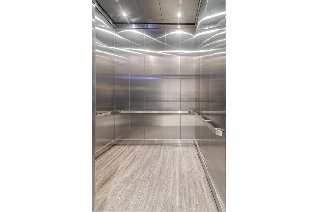 a bowling alley with mirrored walls and wood floors