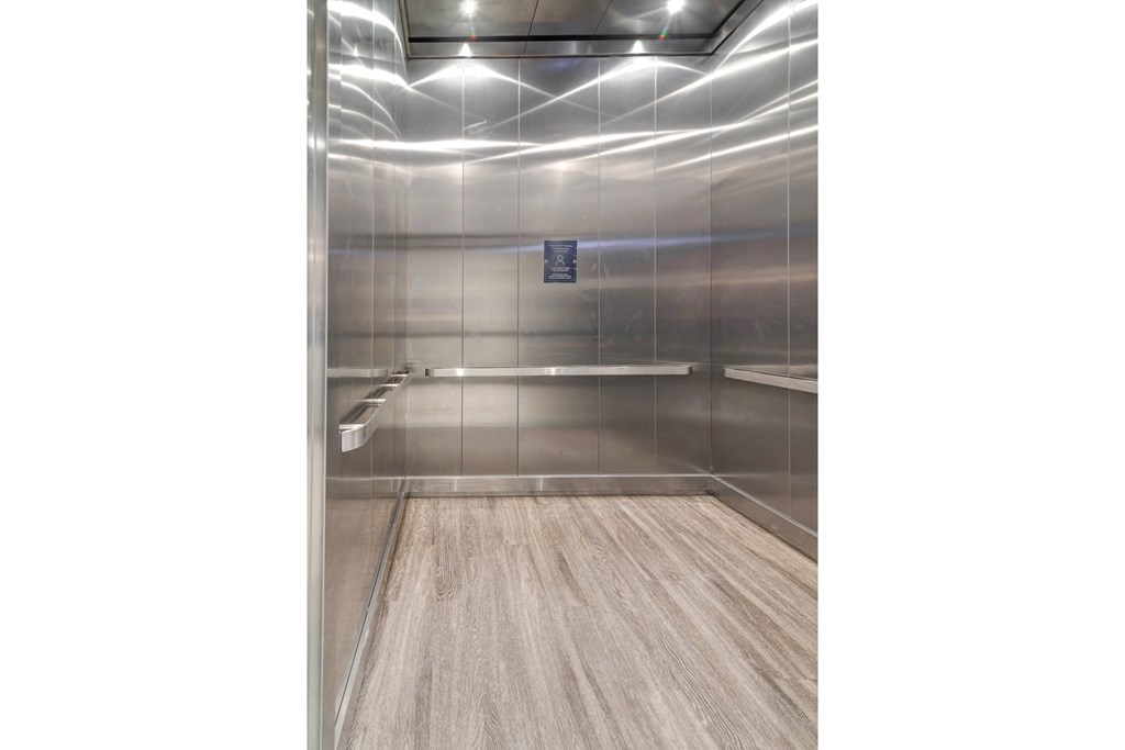 a large room with mirrored walls and a wood floor