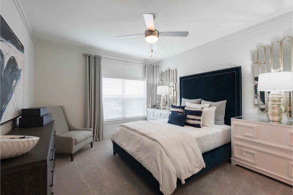 a bedroom with a bed and a dresser