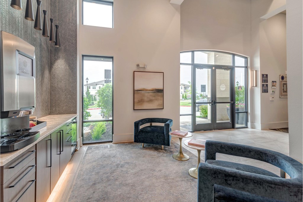 a living room with a couch and a glass door