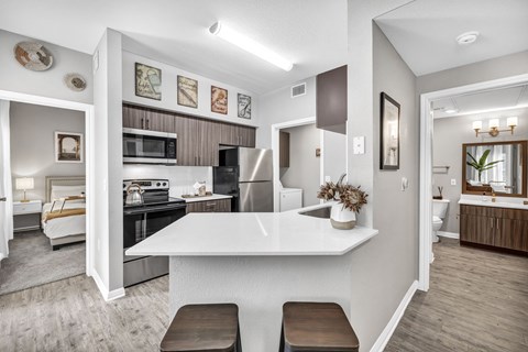 a kitchen with a white counter top
