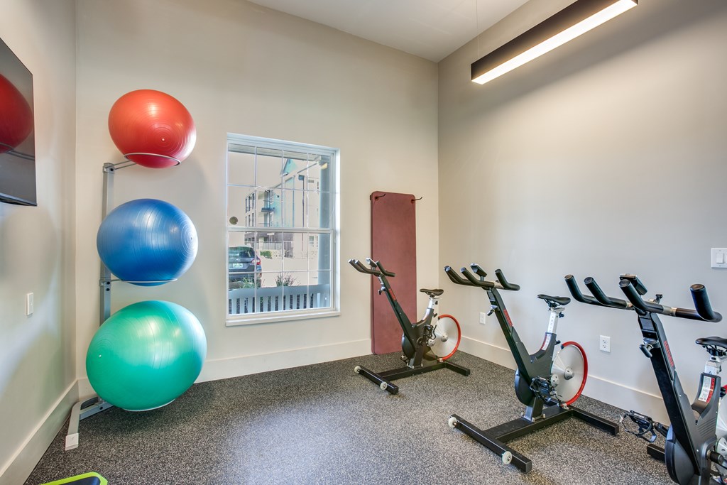 Spin room with spin bikes and ab yoga balls