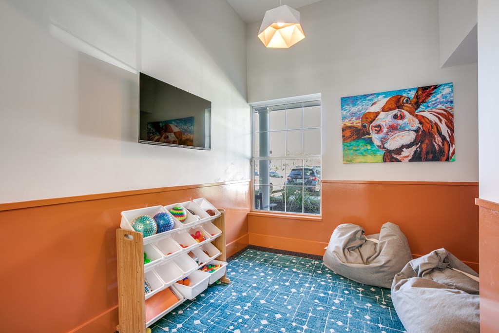 Chill Zone for Small Children in fitness area  with book and tv.