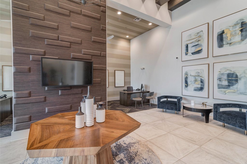 a living room with a tv and a table