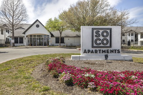 a building with a sign that says so co apartments