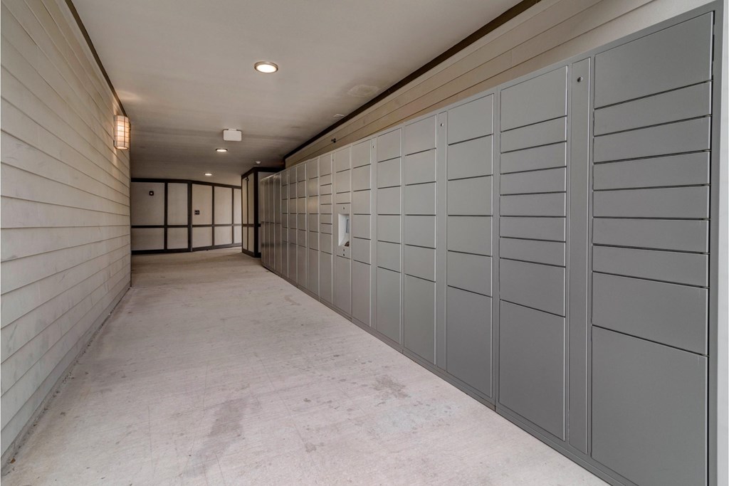 a row of lockers in a long hallway of a building