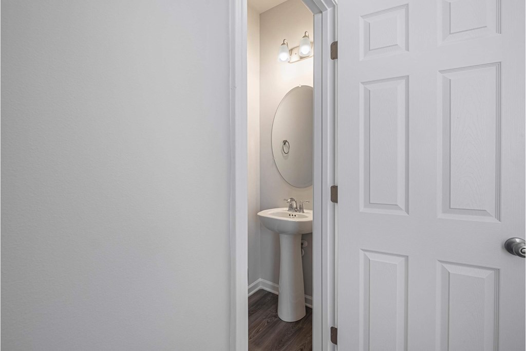 a small bathroom with a sink and a mirror