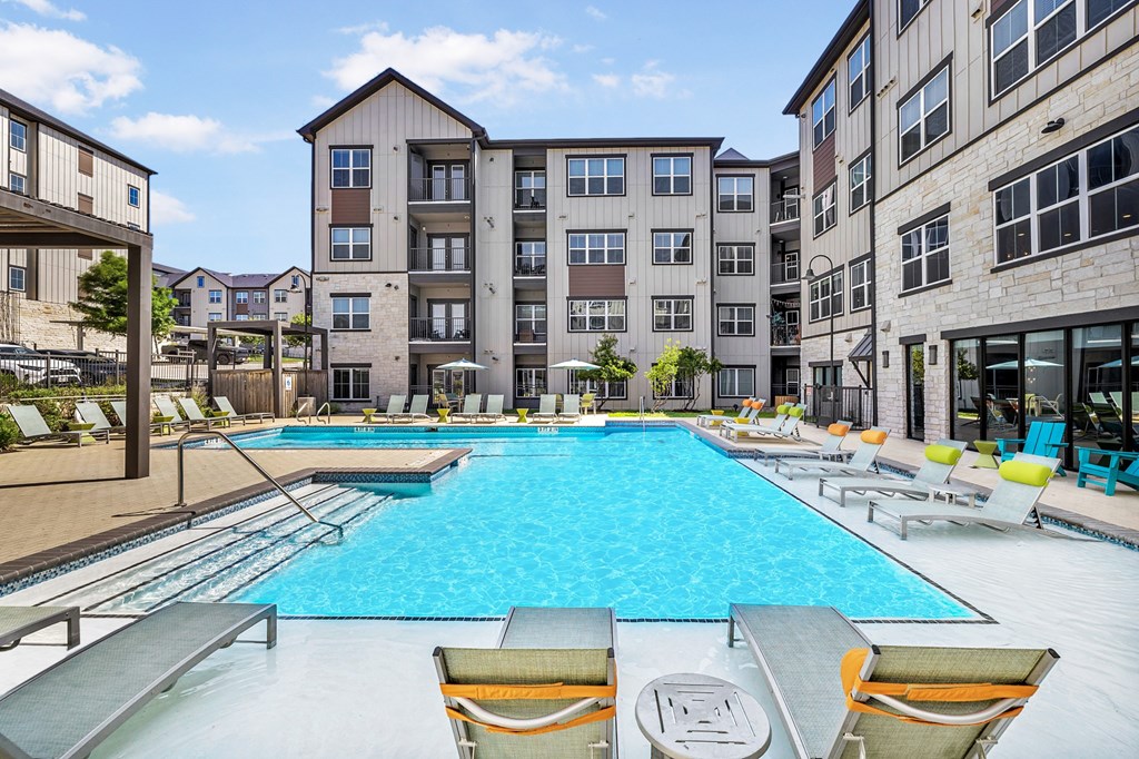 our apartments have a large swimming pool with lounge chairs