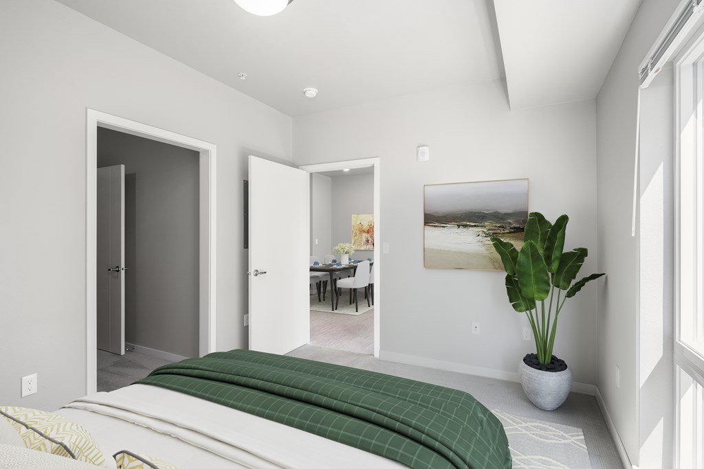 One BR Apartments in Lakeville MN - Lakeside Flats - Carpetted Bedroom, Unfurnished, with Light Grey Walls, Large Windows, and Overhead Lighting