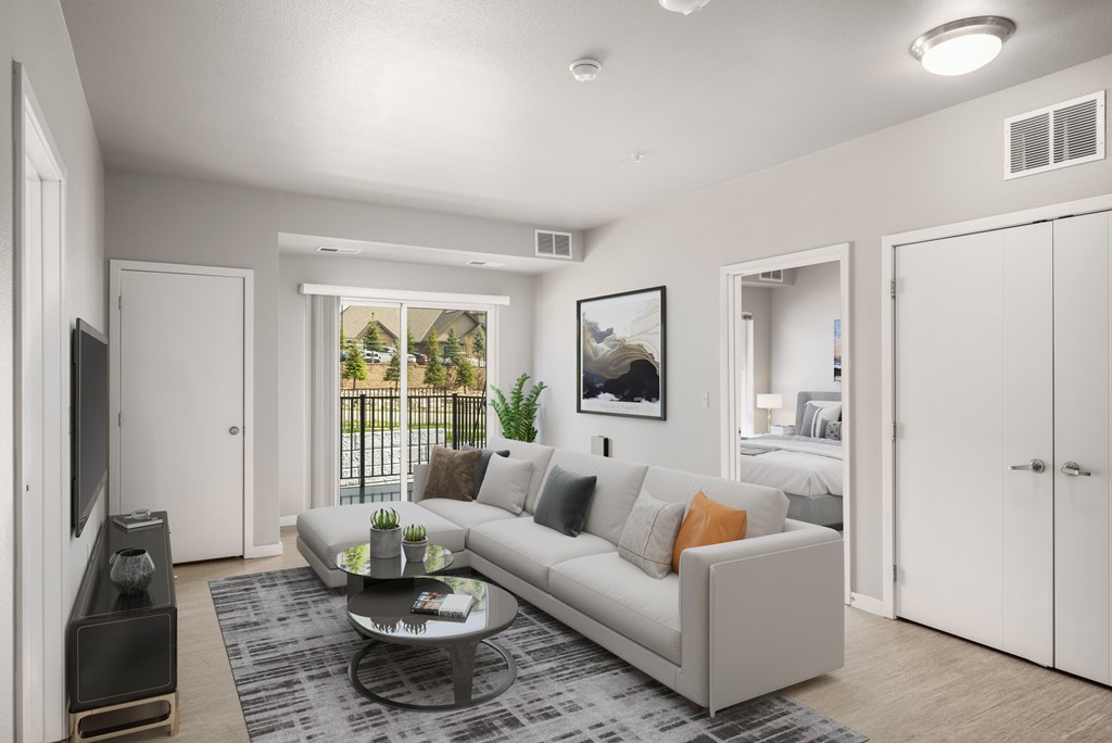 Apartments for Rent in Lakeville MN - Lakeside Flats - Living Room Area, with Plank Wood Flooring, Light Grey Walls, Closet, and Balcony Access, with Large Windows