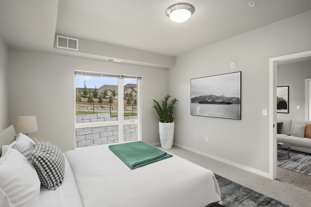 Two BR Apartments in Lakeville MN - Lakeside Flats - Carpetted Bedroom, Unfurnished, with Light Grey Walls, Large Windows, and Overhead Lighting