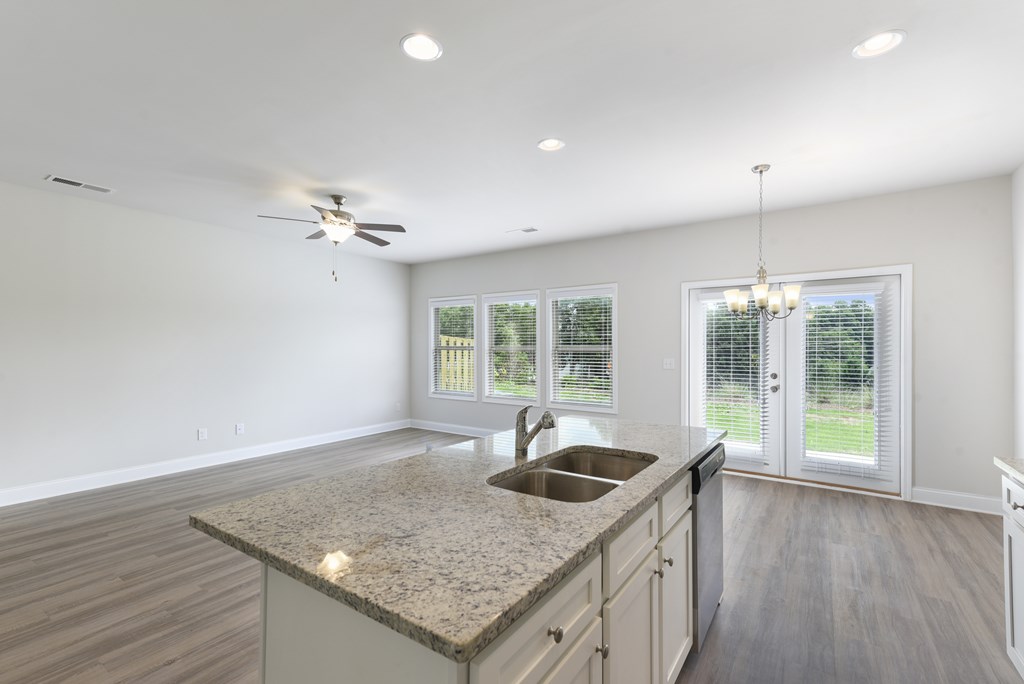 a kitchen with a granite counter top and a sink