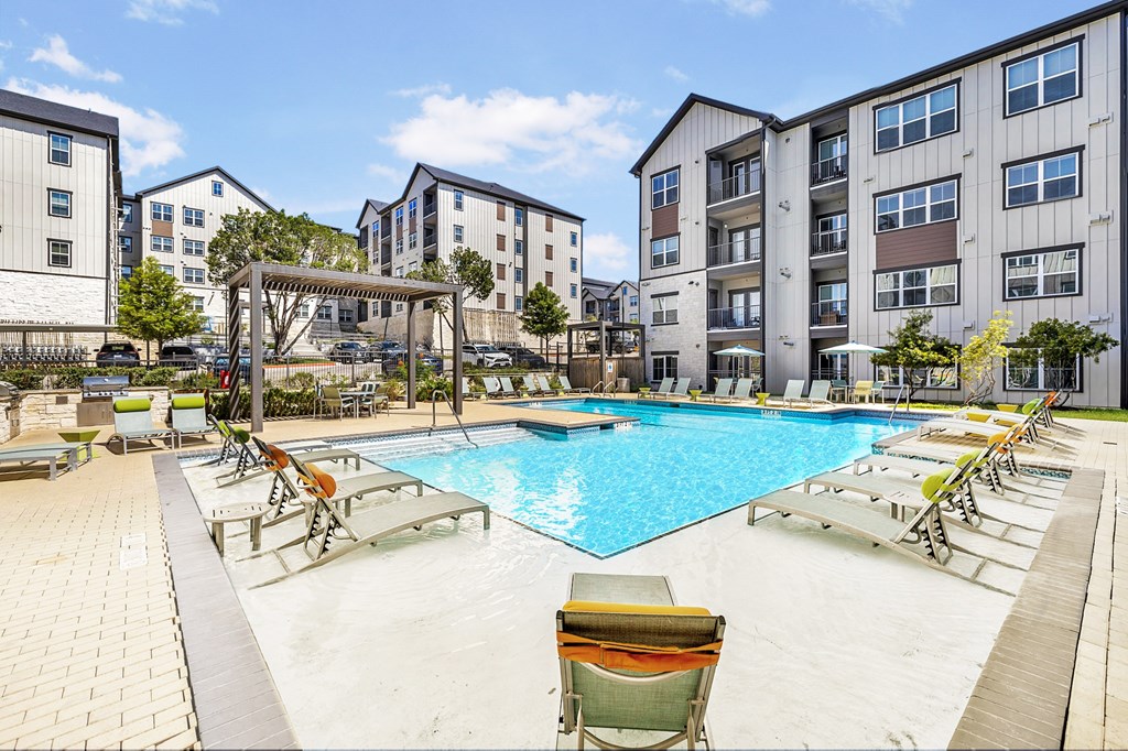 our apartments have a large swimming pool with lounge chairs