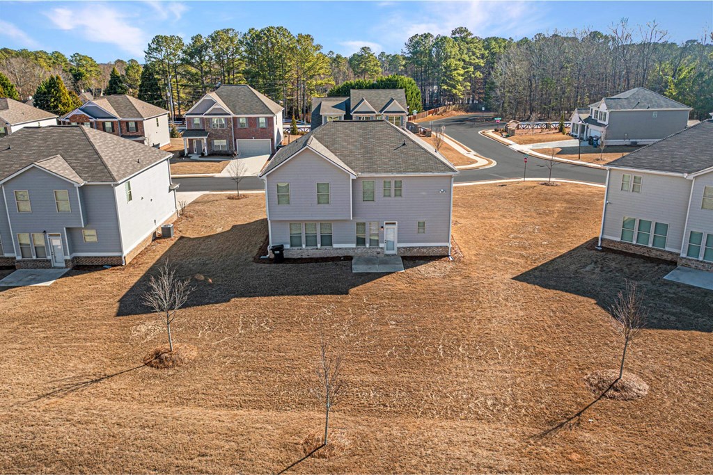 an aerial view of a neighborhood with houses and trees