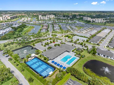 an aerial view of a city with buildings and a pool