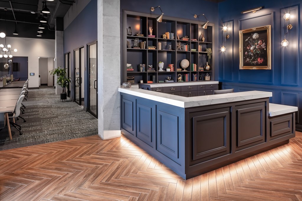 a view of the reception area with blue walls and wood flooring