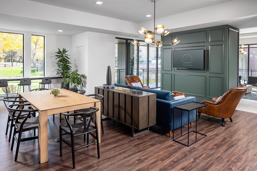 a dining room and living room with a table and chairs