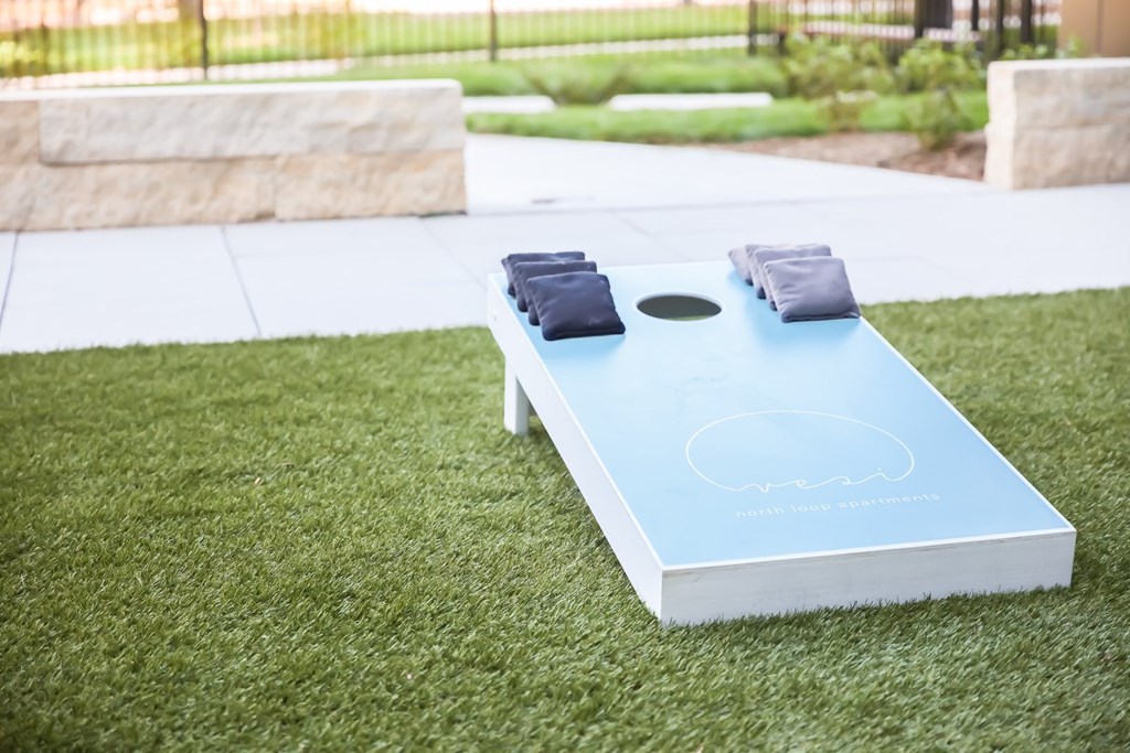 a group of silver spheres and a letter