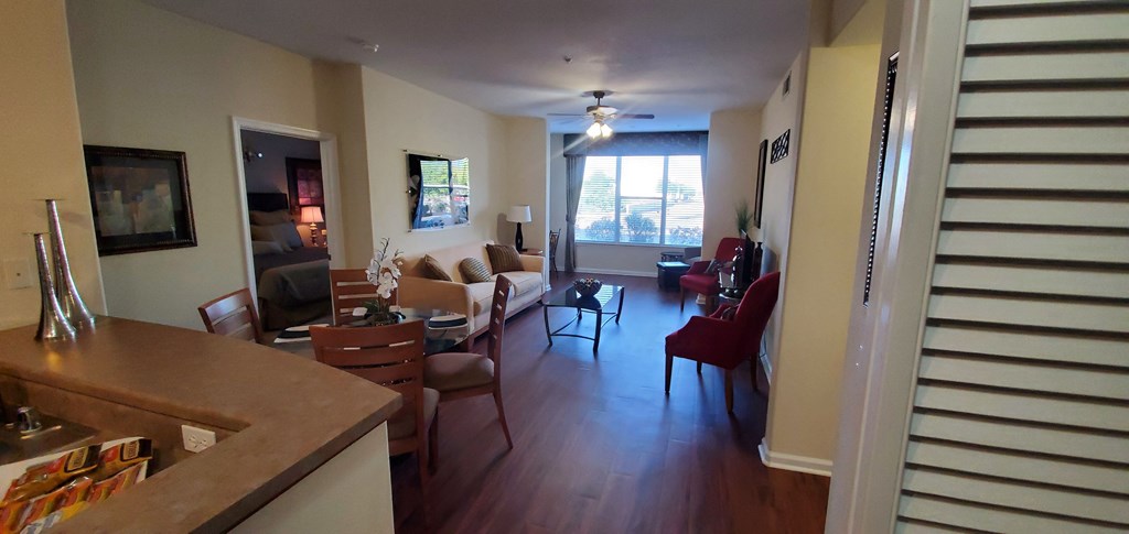 a view from the kitchen into the living room and dining room