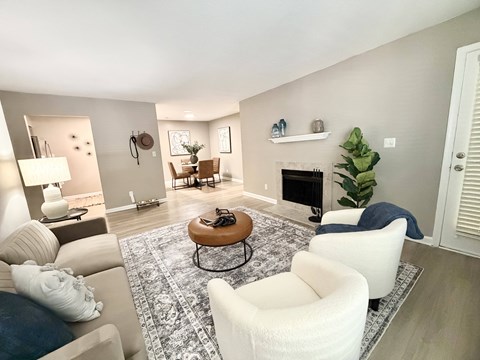 A living room with a fireplace and a couch.
