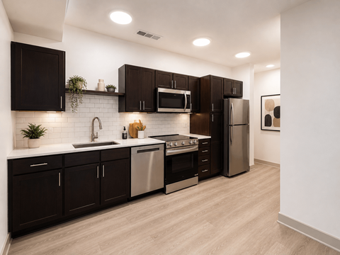 A modern kitchen with dark brown cabinets and stainless steel appliances.