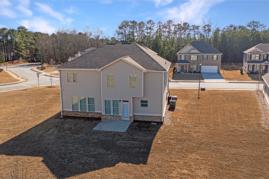 a view of a house from the top of a hill