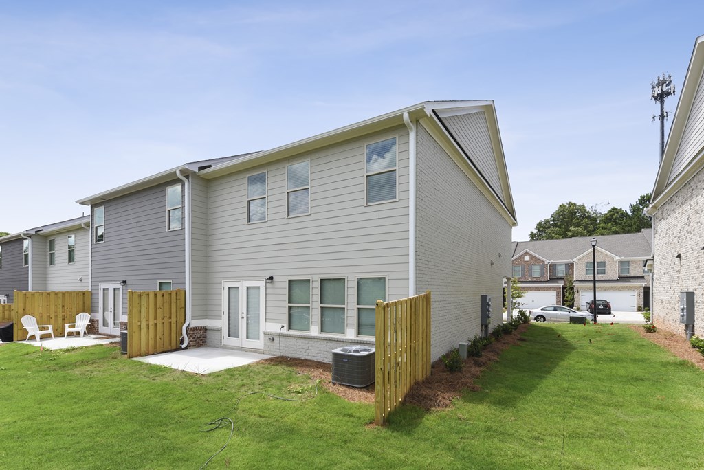 the exterior of a house with a yard and a porch